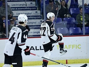 Vancouver Giants' Tyler Thorpe (22) celebrates his goal while teammate Marek Howell (44) looks on during third period Western Hockey League action against the Wenatchee Wild, in Langley, B.C., in a Sunday, Oct. 1, 2023, handout photo.