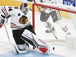 Chicago Blackhawks goaltender Petr Mrazek is scored on by Montreal Canadiens' Cole Caufield (not shown) during second period NHL hockey action in Montreal, Saturday, Oct. 14, 2023.