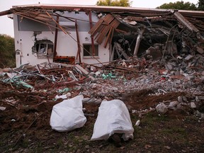Bodybags in front of a house