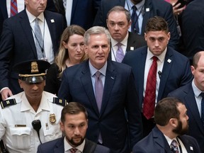 Representative Kevin McCarthy, a Republican from California, center, walks to his office after exiting the House Chamber at the US Capitol in Washington.