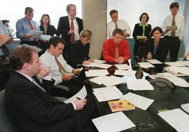Ken Whyte and Martin Newland run a morning news meeting.