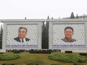 Citizens visit the portraits of the country's late leaders Kim Il Sung and Kim Jong Il on the occasion of the 78th founding anniversary of the Worker's Party of Korea in Pyongyang, North Korea Tuesday, Oct. 10, 2023.
