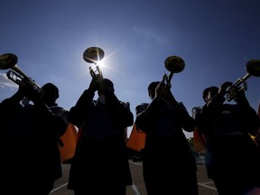 File - The Southern University Human Jukebox marching band warms up before the 2023 National Battle of the Bands at NRG Stadium, Saturday, Aug. 26, 2023, in Houston. Student loan payments resume in October after a three-year pause due to the pandemic.