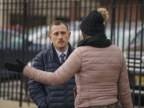 Josh Kruger, left, then the Communications Director, the Office of Homeless Services at City of Philadelphia, at a tent encampment in Philadelphia, on Jan. 6, 2020. The journalist and advocate who rose from homelessness and addiction to serve as a spokesperson for Philadelphia's most vulnerable was shot and killed at his home early Monday, Oct. 2, 2023 police said.