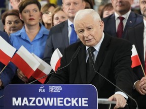 FILE - Jaroslaw Kaczynski, front, the leader of the ruling Law and Justice party, speaks to supporters in Pruszkow, Poland, Sept. 27, 2023. Poland's opposition leader Donald Tusk will lead a march in Warsaw on Sunday Oct. 1, aimed at energizing supporters and winning new hearts in his battle to unseat the right-wing government in the nation's upcoming parliamentary election on Oct. 15.