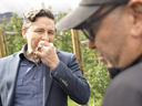 Pierre Poilievre takes a bite out of an apple during an interview with Times Chronicle editor Don Urquhart in a video posted by the Conservative leader Oct. 14, 2023.