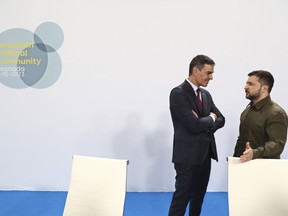 In this photo provided by the Spanish government, Spain's acting Prime Minister Pedro Sanchez, left, speaks with Ukraine's President Volodymyr Zelenskyy at the Europe Summit in Granada, Spain, Thursday, Oct. 5, 2023. Almost 50 European leaders are using a summit in southern Spain's Granada to stress they stand by Ukraine at a time when Western resolve appears somewhat weakened. Ukrainian President Volodymyr Zelenskyy retorted on Thursday that maintaining such unity was now "the main challenge."