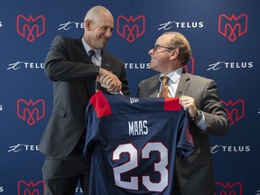 Jason Maas, left, shakes hands with Montreal Alouettes general manager Danny Maciocia in Montreal, Tuesday, December 20, 2022, following a news conference announcing him as new head coach of the team. Maciocia says hiring head coach Maas was his best move of the 2023 CFL season.THE CANADIAN PRESS/Graham Hughes