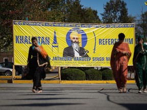A photograph of late temple president Hardeep Singh Nijjar is seen on a banner outside the Guru Nanak Sikh Gurdwara Sahib
