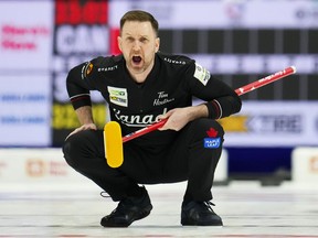 Canada skip Brad Gushue yells as they take on Scotland in the second end of the gold medal game at the Men's World Curling Championship in Ottawa on Sunday, April 9, 2023.