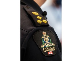 A southern Alberta school division is looking into what conditions may have contributed to four members of a high-school football team being charged with the sexual assault of a teammate. A Lethbridge police arm badge is pictured in Lethbridge, Alta., on Wednesday, March 10, 2021. THE CANADIAN PRESS/David Rossiter