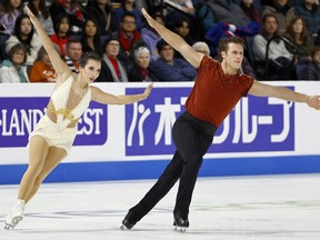 Lia Pereira, left, and Trennt Michaud, of Canada, compete in the pairs free skate program during the Skate America figure skating event in Allen, Texas, Saturday, Oct. 21, 2023.