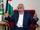 Ghazi Hamad, a member of Hamas' decision-making political bureau, speaks during an interview with The Associated Press in Beirut, Lebanon, Thursday, Oct. 26.