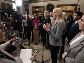 Members of Parliament and reporters listen as Canadian Heritage Minister Pascale St-Onge speaks about a deal with Google, Wednesday, November 29, 2023 in the Foyer of the House of Commons in Ottawa.