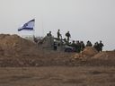 Israeli troops gather near the border with Gaza before entering the Strip on Oct. 29, amid ongoing battles between Israel and Hamas terrorists.