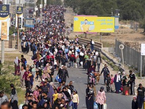 Palestinians flee along a road to the southern Gaza Strip.