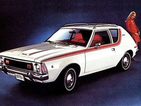 A woman stands next to an AMC Gremlin car in a 1970s ad.