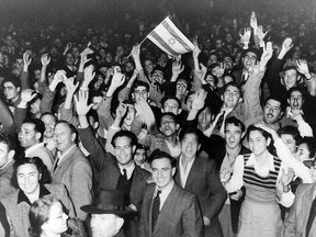 Tel Aviv residents celebrate the UN decision to create a Jewish state by dividing Palestine into two states, one Jewish and one Palestinian, November 29, 1947.