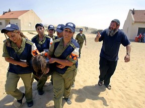 Israeli police as they evict settlers from a Gaza settlement.