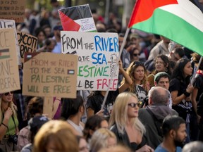Protesters gather for a pro-Palestinian demonstration, in Rome, Saturday, Oct. 28, 2023.