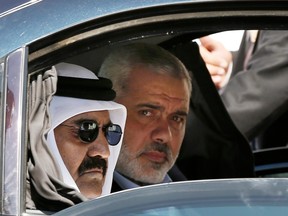 Hamas leader Ismail Haniyeh, right, with Emir of Qatar Sheikh Hamad bin Khalifa al-Thani