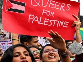 Marchers express solidarity with Palestinians during a Pride Parade in New Delhi on Nov. 26, 2023.