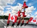 World's first human pyramid behind an electric boat