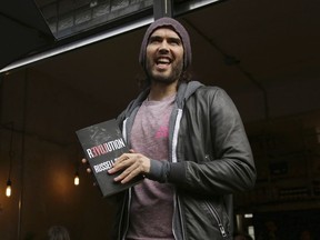 FILE - Russell Brand speaks at the opening of The Trew Era Cafe, a social enterprise community project on the New Era estate in east London, Thursday, 26 March, 2015. Brand has been interviewed by British police over three alleged sexual offenses, U.K. media reported Sunday, Nov. 19, 2023.