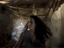 Hadas Calderon is overcome by emotion in the ruins of her mother's home in Kibbutz Nir Oz, southern Israel, Monday, Oct. 30, 2023. The kibbutz was overran by Hamas on Oct. 7, killing or capturing a quarter of its community, including Carmela Dan, Calderon's mother 80, and niece, Noya, 12. Her children Erez, 12, Sahar, 16, and Ofer, 53, the children's father are in Gaza.