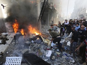 Palestinians look for survivors after an Israeli strike on Rafah, Gaza Strip, Friday, Nov. 17, 2023.