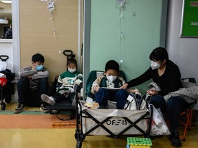Children receive an IV drip in China