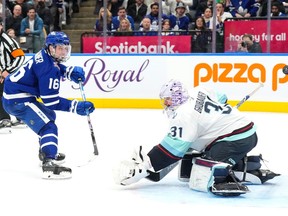 Toronto Maple Leafs' Mitchell Marner scores against Seattle Kraken goaltender Philipp Grubauer during second period NHL hockey action in Toronto, on Thursday, November 30, 2023.