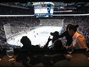 The NHL is going back to a player draft and adding a 3-on-3 women's game as part of an expanded NHL all-star weekend. Customers in the newly redesigned Mastercard Executive Suite at the Scotiabank Arena watch an NHL preseason game in Toronto, Thursday, Oct. 5, 2023.