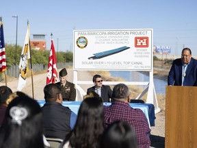 In this image provided by the Gila River Indian Community, Gov. Stephen Roe Lewis gives a speech during the signing of an agreement with the U.S. Army Corps of Engineers to put solar panels over a stretch of irrigation canal on the tribe's land near Chandler, Ariz., Nov. 9, 2023. (Gila River Indian News via AP)