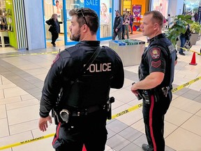 Police contain a scene inside Market Mall after a stabbing on Friday, November 24, 2023.