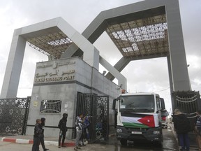 A Jordanian humanitarian aid convoy enters the Gaza Strip from Egypt in Rafah on Monday, Nov. 20, 2023.