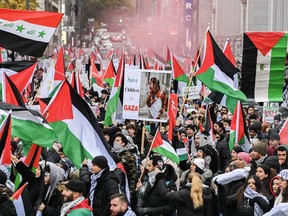 People take part in a Pro-Palestine rally in Montreal on Sunday, Nov. 12, 2023.