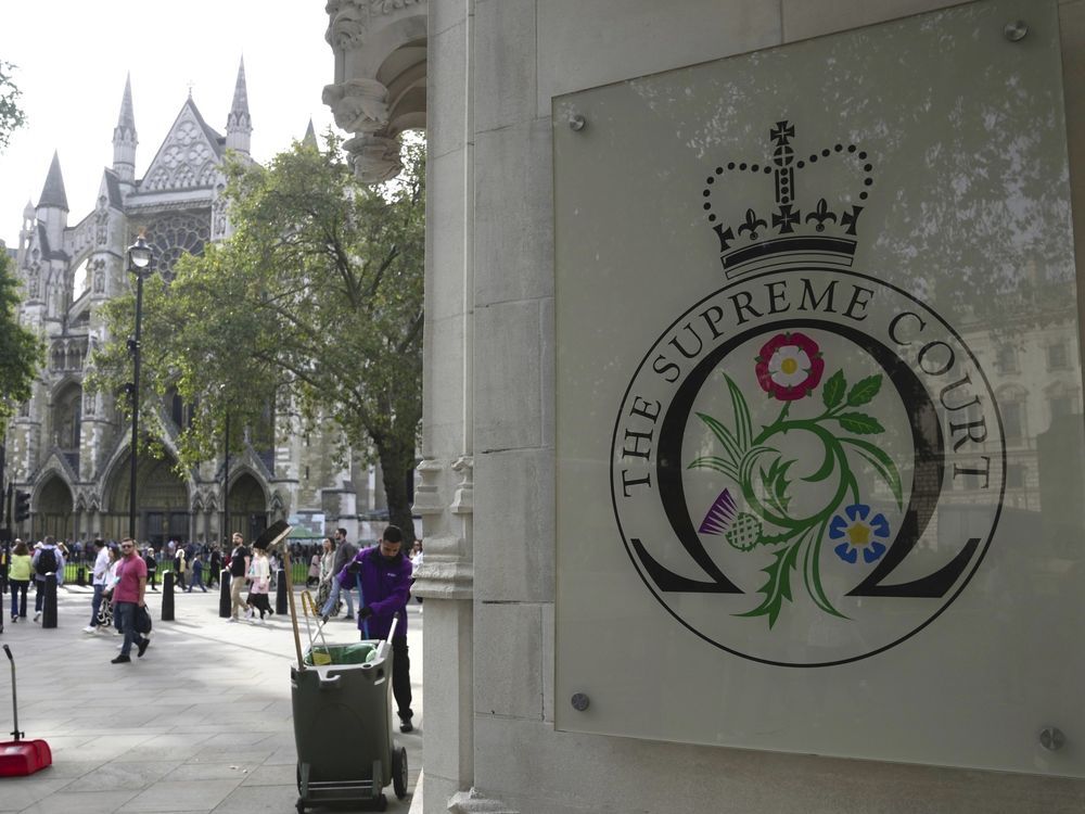 FILE - A view of the entrance of the Supreme Court, in London, Monday, Oct. 9, 2023. Britain's highest court is set to rule Wednesday, Nov. 15 on whether the government's plan to send asylum-seekers to Rwanda is legal, delivering a boost or a blow to a contentious central policy of Prime Minister Rishi Sunak's administration. Five justices on the U.K. Supreme Court will deliver judgment in the government's attempt to overturn a lower court ruling that blocked deportations.