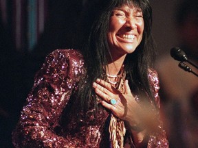 Singer Buffy Sainte-Marie smiles as she accepts the Hall of Fame award at the Juno Awards ceremony in Hamilton on Sunday, March 26, 1995.