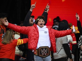 File - Kansas City Chiefs Patrick Mahomes, wearing a WWE belt, celebrates the team's Super Bowl victory at a gathering in Kansas City, Mo., Wednesday, Feb. 15, 2023. The WWE is collaborating with the Big 12 Conference for their championship game next month, as the sports entertainment company further strengthens its relationship with various sports organizations. The Dr. Pepper Big 12 Football Championship will be held on Dec. 2, 2023 at AT&T Stadium in Arlington, Texas.