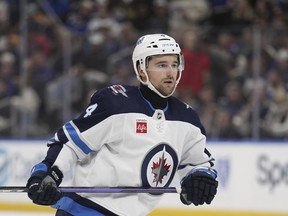 Winnipeg Jets' Neal Pionk wears a neck guard as he plays during the third period of an NHL hockey game against the St. Louis Blues Tuesday, Nov. 7, 2023, in St. Louis.Officials made presentations at the league's annual Toronto meeting on both cut-proof equipment and emergency standards in arenas.&ampnbsp;THE CANADIAN PRESS/AP-Jeff Roberson