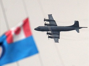 A CP-140 Aurora airplane doing a flyby over Stanley Park to participate in a Battle of Britain commemoration in Vancouver, B.C., September 8, 2019.