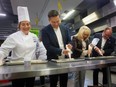 Conservative Party of Canada Leader Pierre Poilievre helps decorate Smile Cookies at the UHC Hub of Opportunities in Windsor with community kitchen GECDSB teacher Adelina DeBlasis (left), UHC CEO June Muir and local MP Chris Lewis (C — Essex) on Wednesday, Nov. 15, 2023.