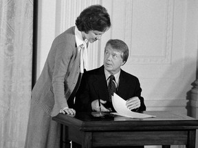 Jimmy Carter talks with his wife, Rosalynn Carter