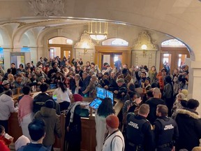 Dozens of protesters fill the entrance to the Saskatchewan legislature in Regnia calling for a ceasefire, in a still frame taken from video made on Monday, Nov. 20, 2023.