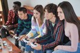 Teens playing video games