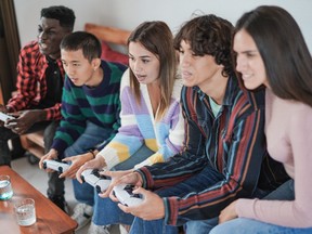 Teens playing video games