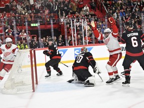 Detroit Red Wings David Perron, second from right, celebrates after scoring during the NHL Global Series Sweden ice hockey match between Detroit Red Wings and Ottawa Senators at Avicii Arena in Stockholm, Sweden, Thursday, Nov. 16, 2023.