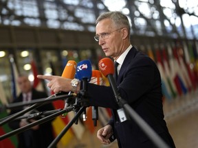 NATO Secretary General Jens Stoltenberg speaks with the media as he arrives for a meeting of EU foreign and defense ministers at the European Council building in Brussels, Tuesday, Nov. 14, 2023. European Union nations on Tuesday acknowledged that they are well on their way to failing Ukraine when it comes to providing their promised part of ammunition that Kyiv so dearly needs to stave off the Russian invasion and win back its territory.