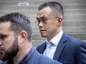 Binance founder and CEO Changpeng Zhao, right, leaves federal court in Seattle, Tuesday, Nov. 21, 2023, after pleading guilty to violations of U.S. anti-money laundering laws.